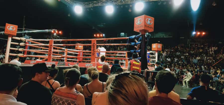 Phnom Penh:Kun Khmer Kickboxing Match at National TV Stadium - The crowd, the drinks, and the rhythm of the night