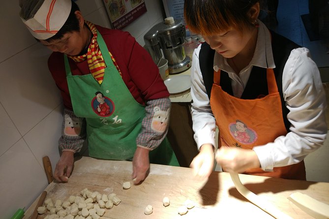 Private Hutong Culture Tour with Dumpling Cooking Class plus Cricket Fighting Game - Through the hutongs by rickshaw